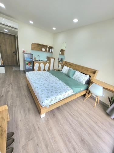 a bedroom with a large wooden bed in a room at LoCo Studio with Netflix and Self Checkin in Ho Chi Minh City