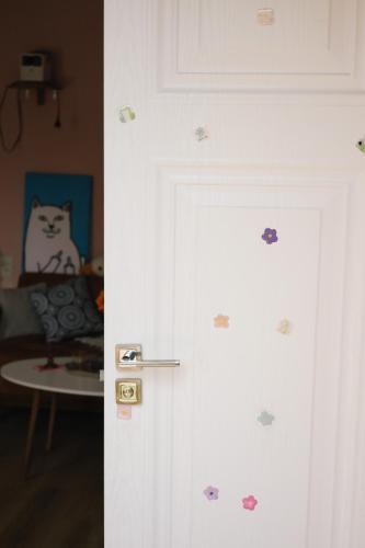 a door with stickers on it in a room at Buna Guest House in Gyumri