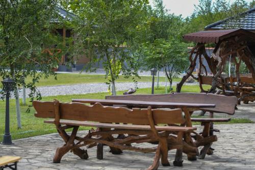 a picnic table and bench in a park at Eko farma Kladovo in Kladovo
