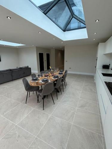 a large dining room with a table and chairs at York Fields Retreat - 4 Ensuite Bedrooms in York