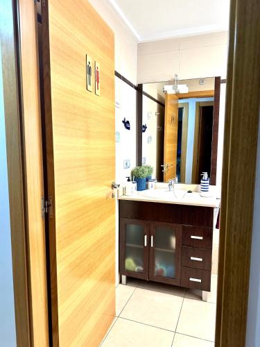 a bathroom with a sink and a mirror at Alicante Hills in Alicante