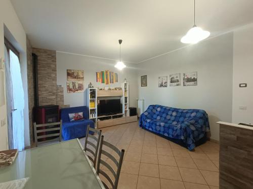 a living room with a couch and a table at House 39 in Capranica