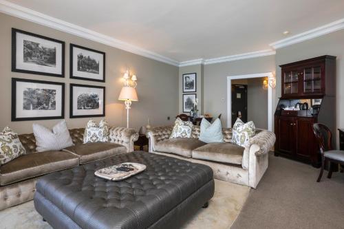 a living room with couches and a table at Beverly Hills in Durban
