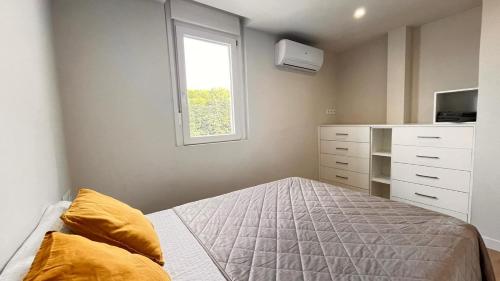 En eller flere senge i et værelse på Apartamento en Cambrils