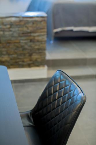 a black shoe sitting on top of a table at Berat River House Boutique Hotel in Berat