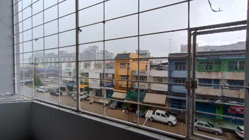 a view of a city from a window at Apartment near Central Festival Hatyai in Hat Yai