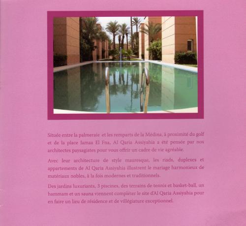 eine Buchseite mit einem Bild eines Schwimmbeckens in der Unterkunft RYAD Pierre in Marrakesch