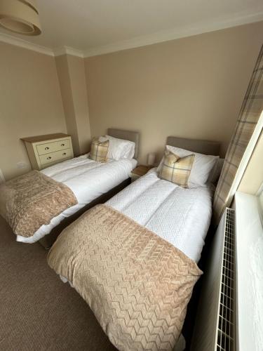 Ένα ή περισσότερα κρεβάτια σε δωμάτιο στο Hamilton Hideaway between Lancaster & Morecambe