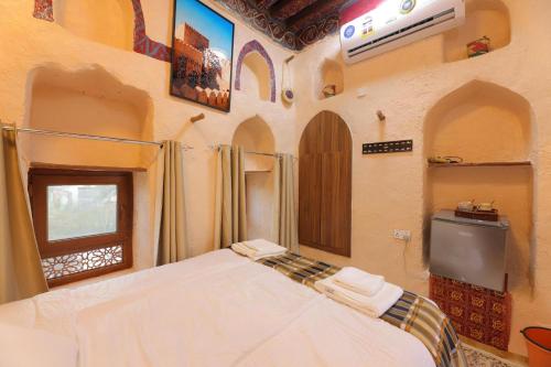 Manazil Inn نزل المنازلにあるベッド
