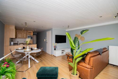 a living room with a couch and a table at City Breeze in Ostend
