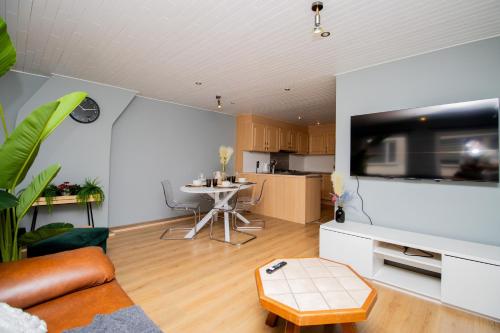 a living room with a couch and a table at City Breeze in Ostend