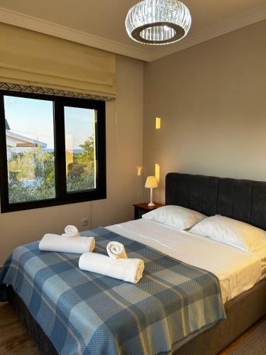 a bedroom with a bed with towels on it at Villa Mulberry, Kyrenia in Kyrenia