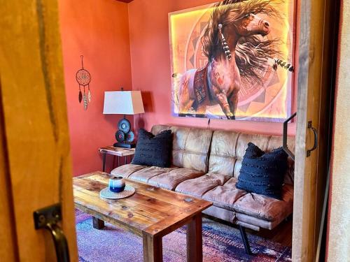 a living room with a couch and a table at Cascade Sunset House - Crater Lake Adventures! in Eagle Point