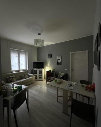 a living room with a couch and a table at Family in Potenza