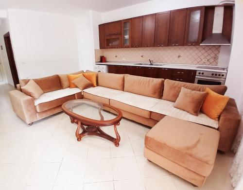a living room with a couch and a coffee table at Casa Kaçi in Mullini i Danit