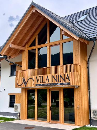 a building with a sign that reads vail inn at Vila Nina Bohinj in Bohinj