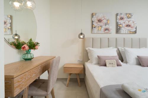 Ένα ή περισσότερα κρεβάτια σε δωμάτιο στο Mellies Suites