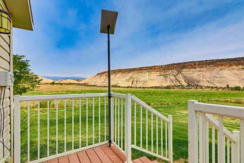 a porch of a house with a view of a field at Ranch House in Boulder! Gateway to Nearby Parks! in Boulder Town