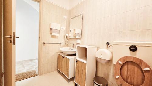 a bathroom with a toilet and a sink at Rooms4you 1 in historic center of Braga in Braga