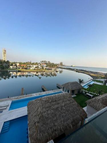 a view of a body of water from a building at Departamento acogedor con vista al mar y alberca in Conchal