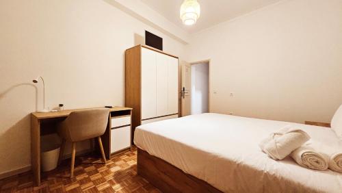 a bedroom with a bed and a desk and a desk at Rooms4you 1 in historic center of Braga in Braga