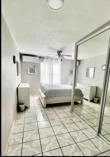 a bedroom with a bed and a mirror at Pal Campo in Hucares