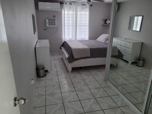 a bedroom with a bed and a mirror at Pal Campo in Hucares