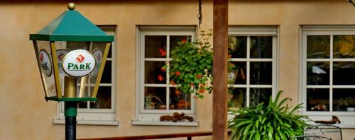 a street light in front of a building with windows at Zum Ochsen in Hauenstein