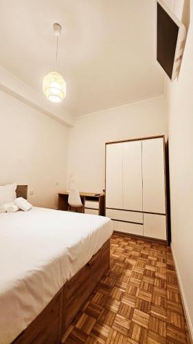 Ένα ή περισσότερα κρεβάτια σε δωμάτιο στο Rooms4you 2 in historic center of Braga