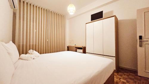 Ένα ή περισσότερα κρεβάτια σε δωμάτιο στο Rooms4you 2 in historic center of Braga