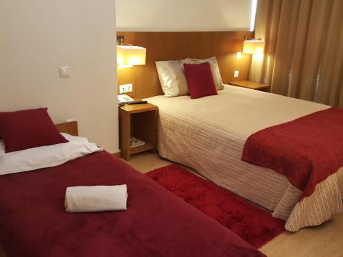 Llit o llits en una habitació de Hotel Jose Alberto