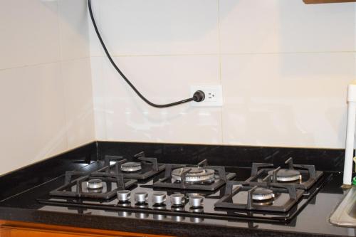 Kuchyň nebo kuchyňský kout v ubytování Apartahotel saquenzipá
