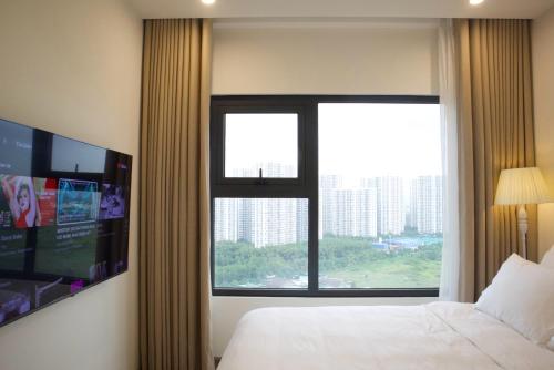 Postel nebo postele na pokoji v ubytování Hera Luxury Apartmant 5 sao - View Excellence