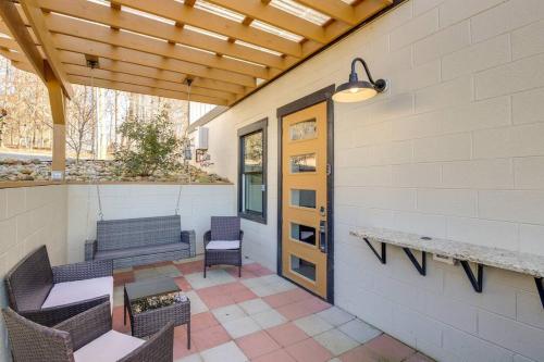 a patio with a bench and a table and chairs at Luxury Barndo 2AN Europe Style Farm Stay Chickens in Jefferson City