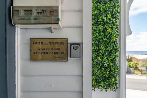 a door with a sign that reads once ill ever get outside at Beautifully Renovated Retreat Modern Comfort with Outdoor Entertaining in Burnie