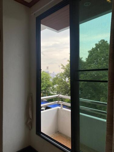 a window in a room with a view of a balcony at New Siam II in Bangkok