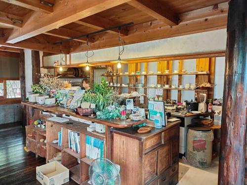 a shop with a counter with a person in the background at 4BRHouse near Nikko Suginami Cedar Avenue in Nikko