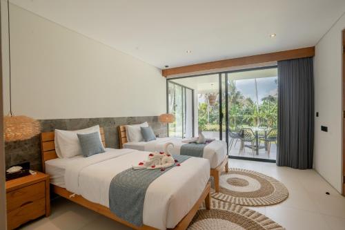 Postel nebo postele na pokoji v ubytování Villa Ravaka Ubud