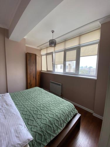 Llit o llits en una habitació de ЖК Весна