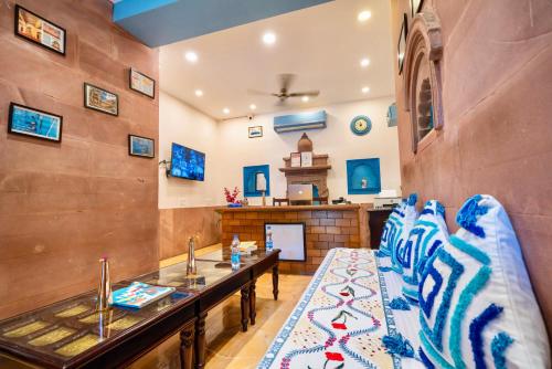 a living room with a couch and a table at Kankariya Heritage in Jodhpur