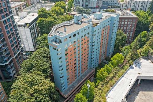 an overhead view of a tall building with trees at Vibrant Downtown, King Bed, Work Desk & Kitchen in Seattle