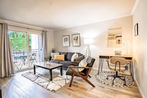 a living room with a couch and a desk at Condo with king bed, walk to Microsoft & park in Bellevue