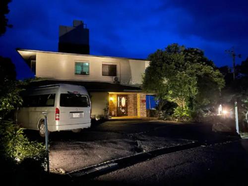 a white van parked in front of a house at night at Izu One Club - Vacation STAY 20411v in Futo