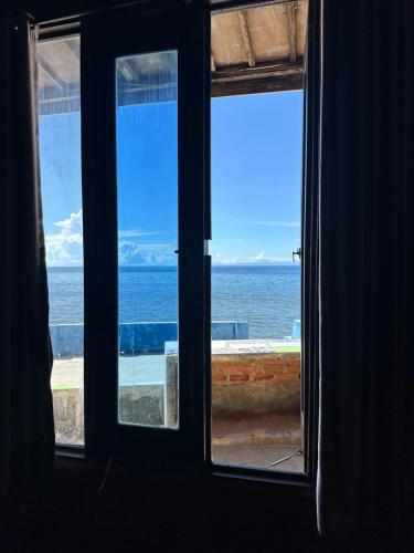 an open window with a view of the ocean at Mooi Park in Sorong