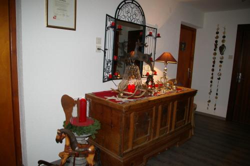 a room with a mirror and a wooden dresser at Thalerhof in Roppen