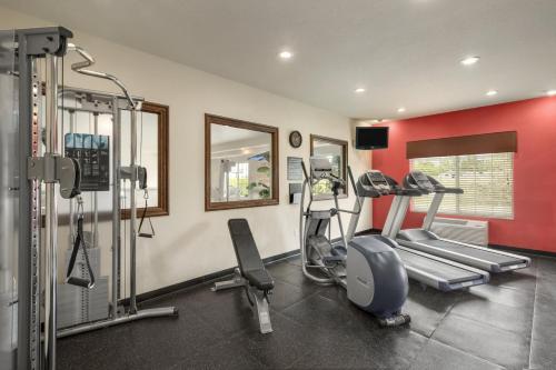 a gym with cardio equipment in a room at Country Inn & Suites by Radisson, Minot, ND in Minot