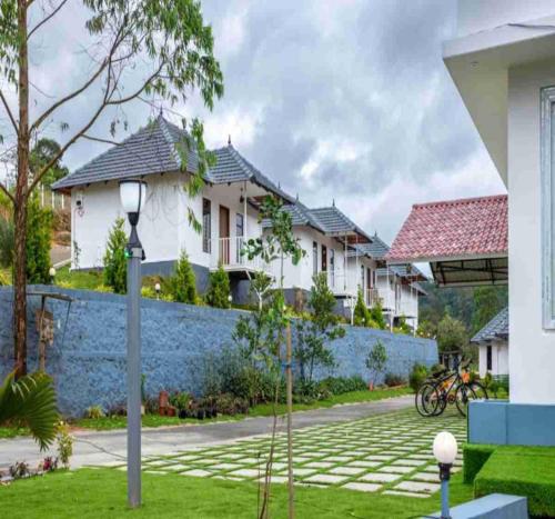 a view of a house from the street at Le Serene Munnar Luxury Resorts & Spa in Ūdumbanshola