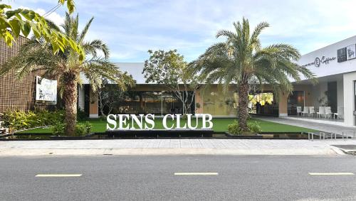 a building with a sign that reads sans club at Sens Club in Thốt Nốt