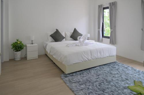 Ένα ή περισσότερα κρεβάτια σε δωμάτιο στο Zen Beach Lake Villa 1