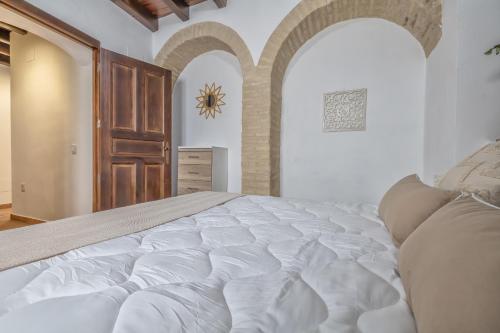 Postel nebo postele na pokoji v ubytování El Capricho de 1849 & Parking